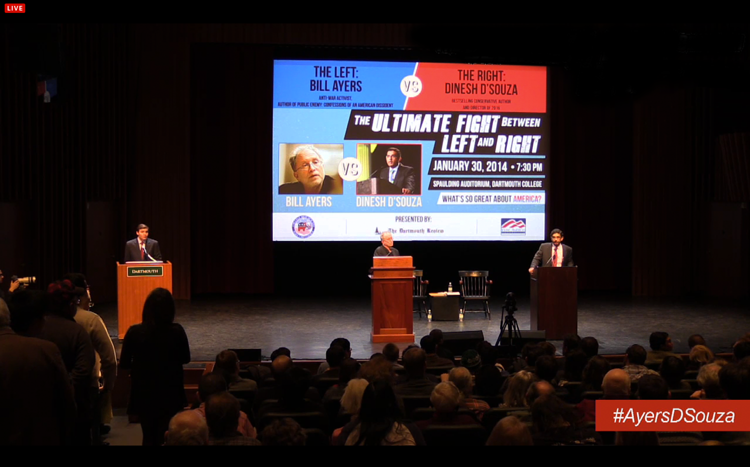 Two politicians debating on a stage